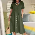 Detail of a green cotton linen dress featuring a V-neckline and button-down front. - S / Top And Bottom / Army Green
