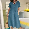 Close-up detail of blue cotton linen midi dress featuring V-neckline and button-down front - Haze Blue