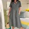 Close-up of solid grey cotton linen dress with V-neck and button details - Gray