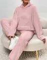 Detailed view of a soft pink fuzzy two-piece lounge set with hooded top and pants. - Pink