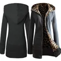 Detailed view of a dark grey women's zip-up hoodie with stylish leopard lining. - Dark Gray