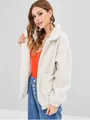 Close-up detail of a white fuzzy zip-up jacket featuring large pockets and soft texture. - S / Tops / White