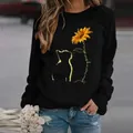 Detailed view of the cat and sunflower print on a black casual long-sleeved sweatshirt - S / Tops / Cat Black