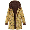 Detailed view of a vintage floral print hooded coat with warm plush brown lining. - 3XL / Tops / Plant Yellow