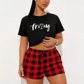 Women's pajama set featuring a black Friday print crop top and red buffalo plaid shorts - S / Top And Bottom / Friday Print-Black