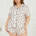 Plus size women's pajama set in light pink with black bow print short sleeve shorts - 6XL / Top And Bottom / Light Orange With Black Bow Print