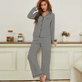 Zwart-wit gestreepte damespyjama set met top met lange mouwen en knopen en lange broek - M / Top en Broek / Zwart-witte Strepen