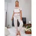 Elegant pink satin two-piece pajama set with crop short sleeve top and jogger pants - S / Top And Bottom / Champagne