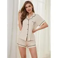 Elegante set pigiama corto da donna color crema con bordini neri e dettaglio cuore - Taglia S / Top E Pantaloni / Beige