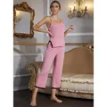 Elegante set pigiama rosa con canotta a spalline sottili e pantaloni con pizzo - Rosa
