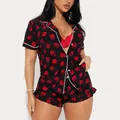 Comfortable women's two-piece short sleeve pajama set with festive red gift box print design - Black Gift Box Print
