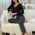 Cozy women's 2-piece loungewear set featuring long sleeve black top and plaid pants - L / Top And Bottom / Black