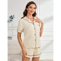 Elegant women's beige short sleeve pajama set with black contrast piping and matching shorts - S / Top And Bottom / Beige