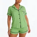Front view of women's lime green modal pajama set with black piping and heart pocket - Light Green
