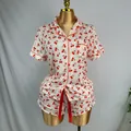 Women's white pajama set with red cherry print featuring short sleeve top and matching shorts - S / Top And Bottom / Beige Cherry Print