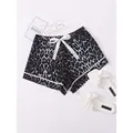 Leopard print women's summer pajama shorts with white bow tie and stylish trim detail - S / Bottoms / Black and Grey Leopard