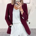 Close-up detail of burgundy corduroy blazer showing fine rib texture and sleeve buttons - S / Tops / Burgundy