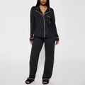 Black women's pajama set with white piping, long-sleeve shirt and pants loungewear - S / Top And Bottom / Black