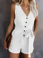 Close-up detail of a white V-neck sleeveless romper with button front and tie waist bow - S / Top And Bottom / White