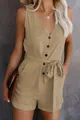 Close-up detail of a khaki V-neck romper featuring front buttons and a waist bow tie - S / Top And Bottom / Khaki