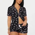 Pyjama deux pièces noir pour femme avec imprimé nœud rose et manches courtes élégant - Imprimé Noeud Rose (Noir)
