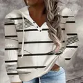 Detailed view of women's V-neck hooded sweatshirt with black and white striped pattern - S / Tops / White Striped