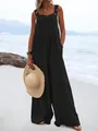 Close-up detail of black wide-leg sleeveless jumpsuit for women in a summer beach setting - S / Top And Bottom / Black