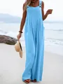 Sky blue sleeveless wide-leg jumpsuit overalls worn by a model on a sunny beach - S / Top And Bottom / Lake Blue