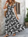 Detail view of a black and white leaf print maxi dress with a V-neckline and short sleeves. - S / Tops / Black with Bamboo Leaf Print
