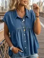 Lifestyle detail of a blue denim button-down peplum top worn on an urban bridge backdrop - S / Tops / Dark Blue