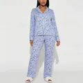 Elegant two-piece women's pajama set in light blue with floral print and white piping - Blue Floral