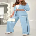Full body view of stylish light blue two-piece blazer suit set with elegant wide-leg trousers - XS / Top And Bottom / Light Blue