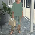 Detail view of women's casual 2-piece set with sage green top and floral trousers - XS / Top And Bottom / Grass Green/Vintage Floral