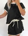 Conjunto informal de dos piezas para mujer con camiseta negra de hombros caídos y pantalones. - S / Top Y Pantalón / Negro