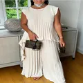 Elegante set due pezzi plissettato beige con top a maniche corte e pantaloni larghi - Bianco avorio