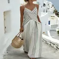 Detailed view of a white and black striped sleeveless jumpsuit with cross-over V-neck design. - S / Top And Bottom / White
