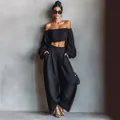 Chic black two-piece set featuring off-shoulder puff sleeve crop top and wide-leg trousers - S / Top And Bottom / Black