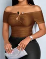 Close-up of off-the-shoulder ruched top with metallic buckle detail on tan model. - S / Tops / Dark Brown