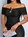 Close-up of a sexy black off-the-shoulder ruched top with a metal buckle detail. - S / Tops / Black