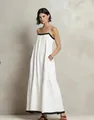 Elegant white tiered maxi dress featuring black contrast trim and thin spaghetti straps. - S / Bottoms / White