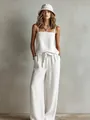 Detailed studio shot of a white linen-style camisole and wide-leg trousers set - White
