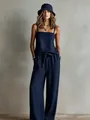 Stylish navy blue two-piece set featuring a spaghetti strap top and wide-leg trousers - S / Top And Bottom / Navy Blue
