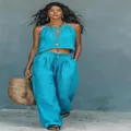Elegant bohemian cyan two-piece summer outfit featuring a halter crop top and wide-leg pants - S / Top And Bottom / Lake Blue
