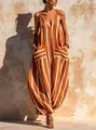 Detail shot of a burnt orange V-neck striped cotton linen wide-leg jumpsuit for women. - S / Top And Bottom / Orange