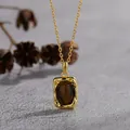 Close-up detail of a vintage S925 silver necklace with a natural tiger's eye pendant. - Tiger Eye-Gold