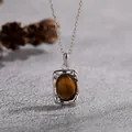 Detailed view of an S925 sterling silver necklace featuring a natural tiger's eye stone. - Tiger Eye-Silver