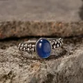 Detail view of a retro S925 silver ring featuring an oval blue kyanite gemstone on stone - Natural Kyanite