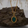 Detailed macro shot of gold box chain necklace with oval green malachite gemstone - Natural Malachite Necklace / Gold