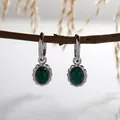 Close-up of S925 silver earrings with natural oval malachite and vintage texture - Natural Malachite Earrings / Silver