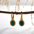Close-up of S925 sterling silver hoop earrings with oval malachite stones - Natural Malachite Earrings / Gold